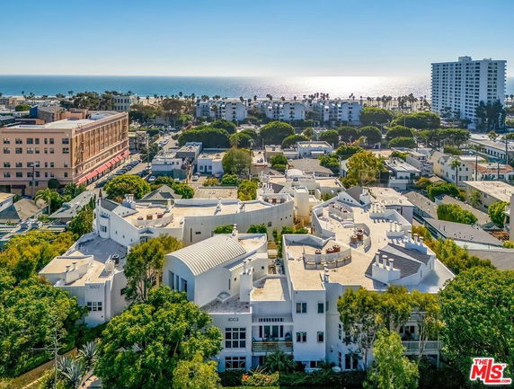 Panoramic view of buildings with ocean in the background.