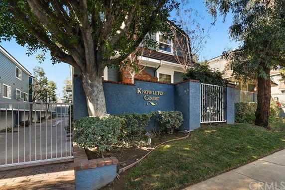Front view of a building with an entry gate and a sign reading 'Knowleton Court'.