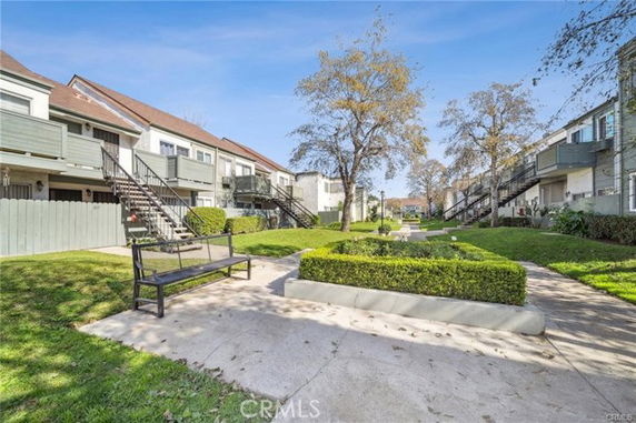 Front view of apartment buildings with outdoor staircases.