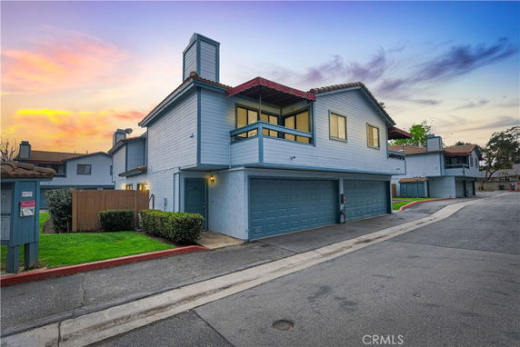 Front view of a two-story house with a double garage.