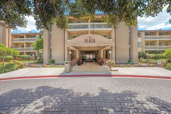 Front view of a multi-story building with an entrance labeled 'The Plaza'.