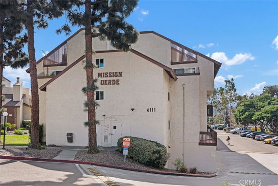 Front view of a multi-story building labeled 'Mission Verde'.