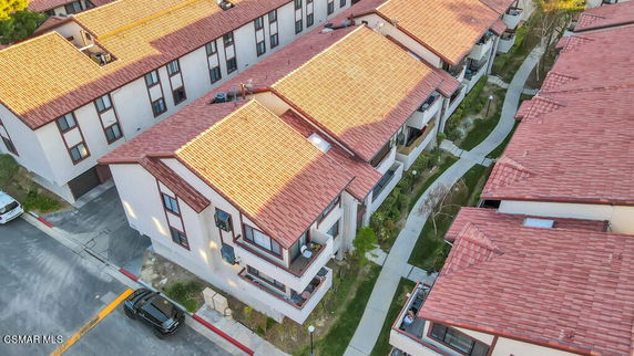 Aerial view of buildings with red-tiled rooftops.
