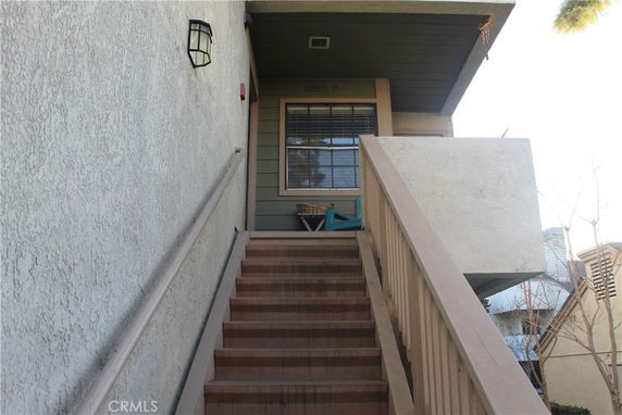 Exterior staircase leading to the entrance of a building unit.