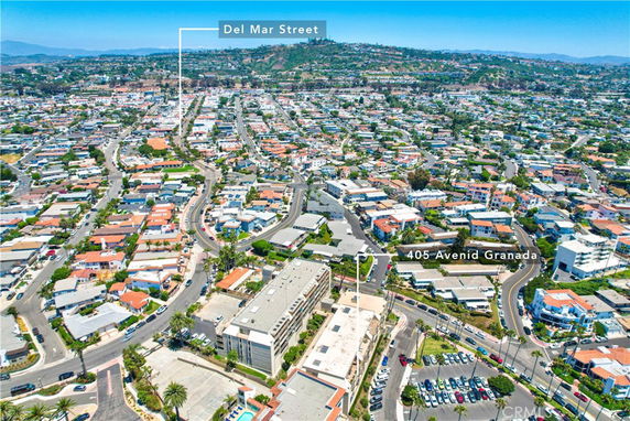 Aerial view of a residential neighborhood with labels pointing to specific street and address.