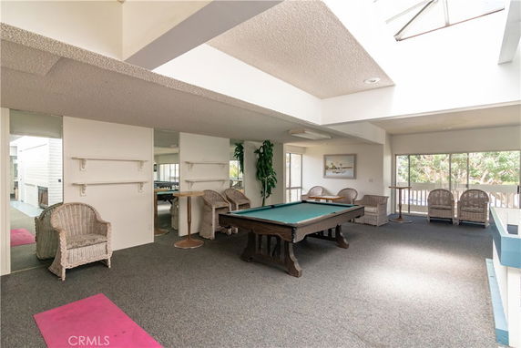 Indoor room with a pool table and seating area.