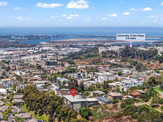 Panoramic view of a cityscape with nearby ocean.