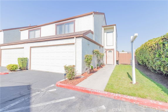 Front view of a two-story house with attached double garage.