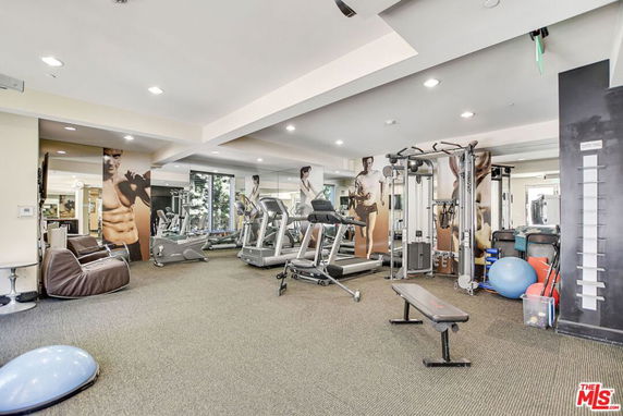 Gym area with various exercise equipment.