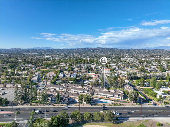 Panoramic view of suburban neighborhood with multiple houses and streets.