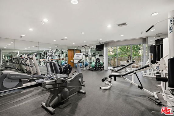Indoor gym area with various exercise equipment.