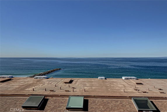 Rooftop view with skylights overlooking a vast ocean.
