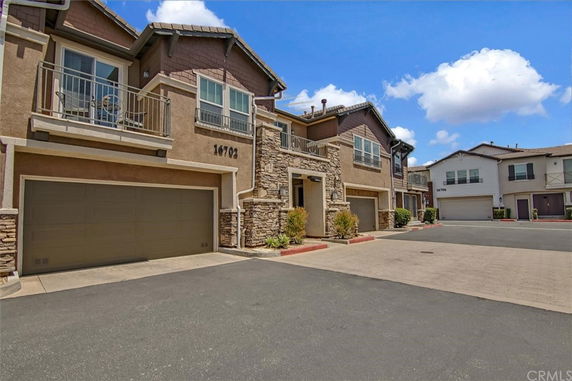 Front view of a two-story house with a double garage.