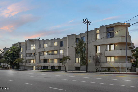 Front view of a multi-story apartment building.