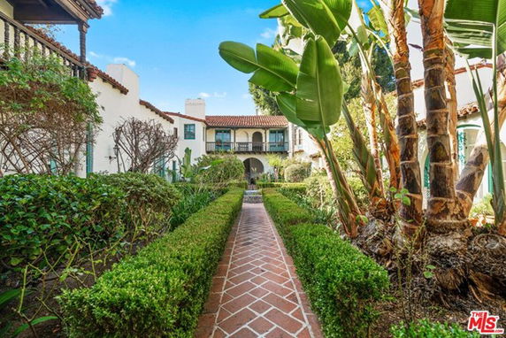 Front view of a house with a garden path leading to the entrance.