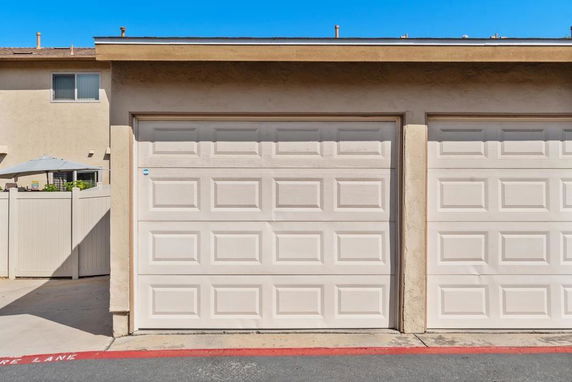 View of a garage door in an outdoor parking area.