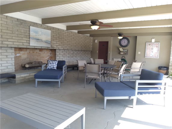 Indoor recreation area with seating and a fireplace.