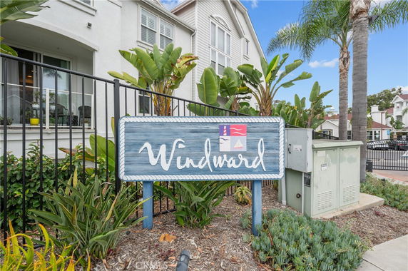 Front view of a residential building with a sign reading 'Windward.'