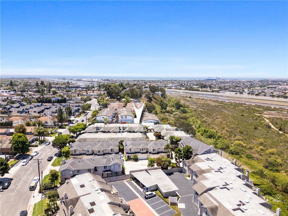 Panoramic view of residential area with houses and surrounding landscapes.
