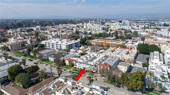 Panoramic view of a residential area with numerous buildings and a clear sky.