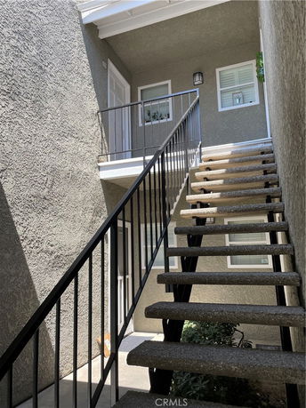 Outdoor staircase leading to the second floor of a building.