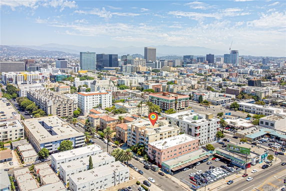 Aerial view of a cityscape with multiple buildings and high-rises.
