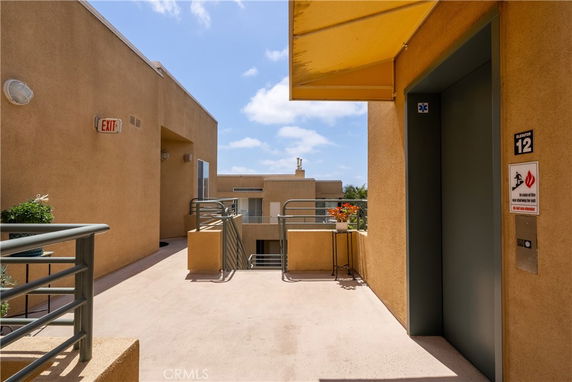 Rooftop view with elevator access in a multi-story building.