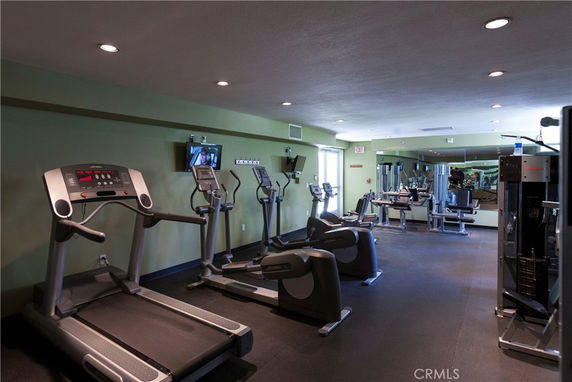 Indoor gym equipped with treadmills and exercise machines.
