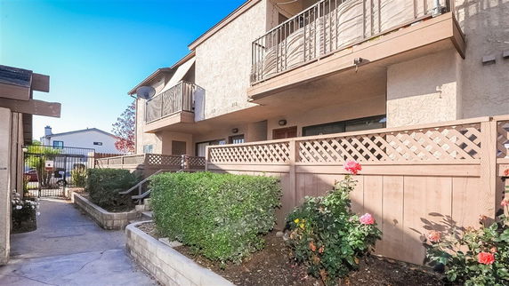 Front view of a two-story residential building with balconies.