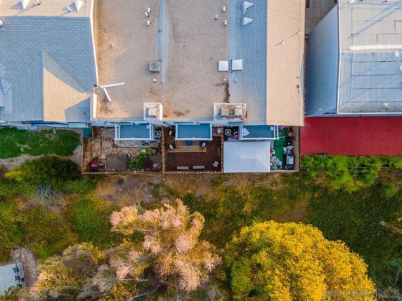 Aerial view of a building showcasing a rooftop with several vents and chimneys.