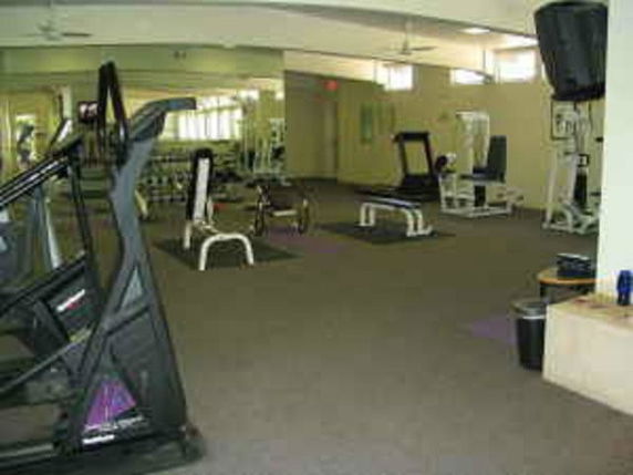 Indoor gym area with exercise equipment.