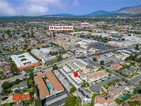 Panoramic view of a suburban area with residential and commercial buildings.