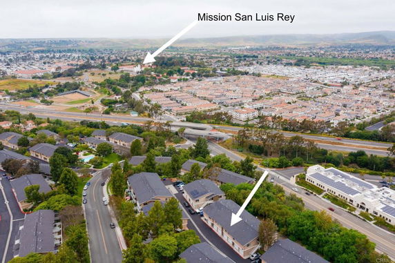 Panoramic view of a residential area with buildings and roads.
