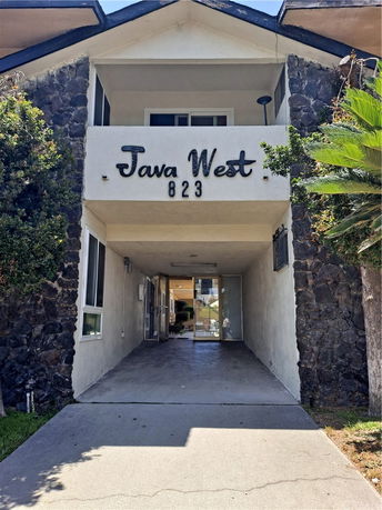 Front view of a building with 'Java West 823' on the facade.