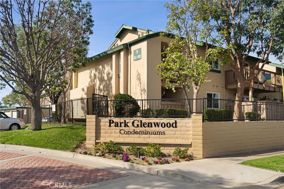 Front view of a condominium building with a sign reading 'Park Glenwood Condominiums'.