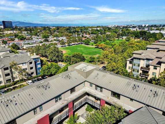 Panoramic view of a residential area with buildings and green spaces.