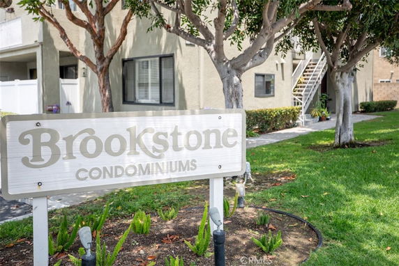Front view of Brookstone Condominiums with visible stairs and windows.