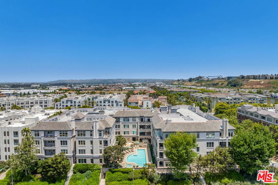 Wide view of a residential complex with surrounding area.