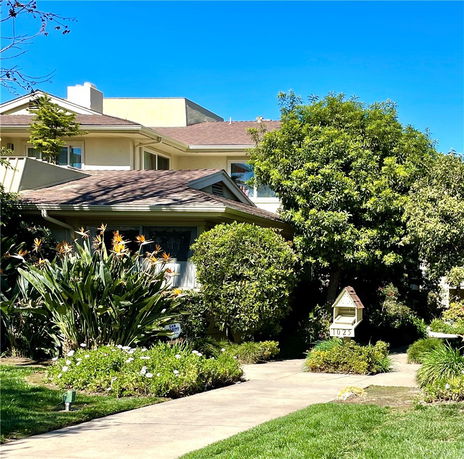 Front view of a two-story house with a pitched roof.