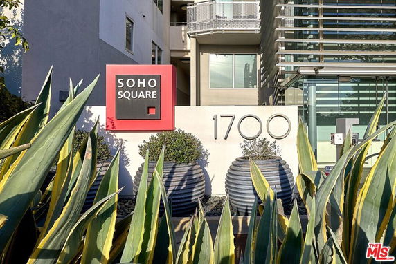 Front view of a building with a sign reading 'SOHO SQUARE' and address number '1700'.