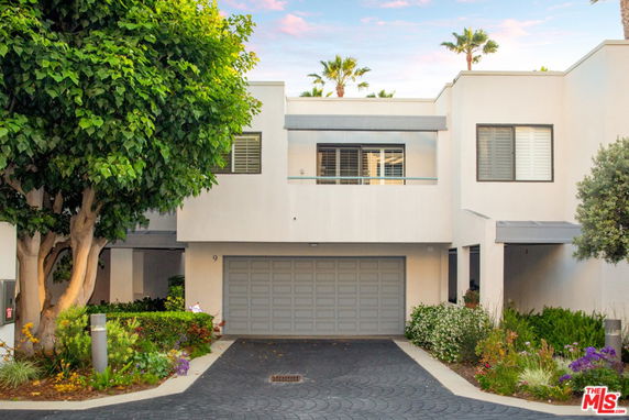 Front view of a two-story house with a double garage.