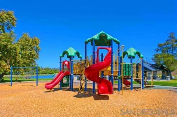 Playground with multiple slides and climbing structures.