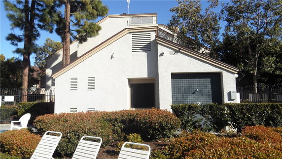 Front view of a two-story building with a sloped roof.