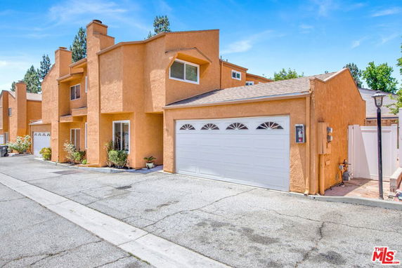 Front view of a two-story house with a double garage.