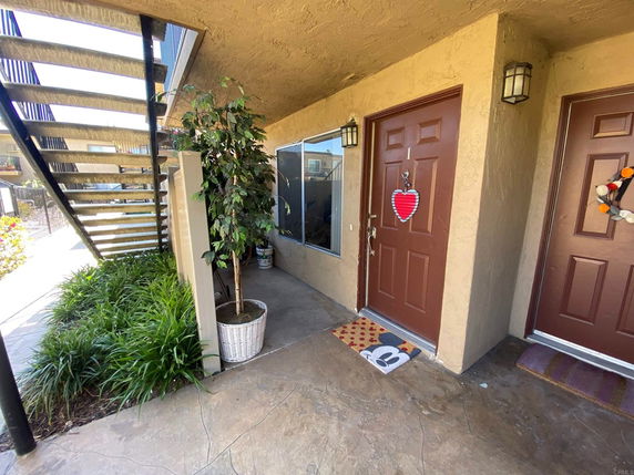 Entrance area of a building with two doors and a staircase
