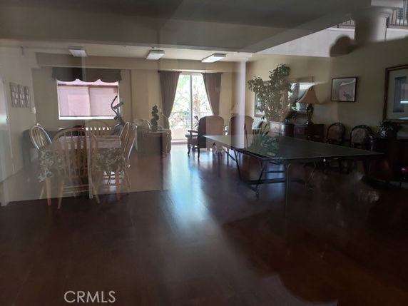 Indoor recreational area with a dining table and a seating arrangement.