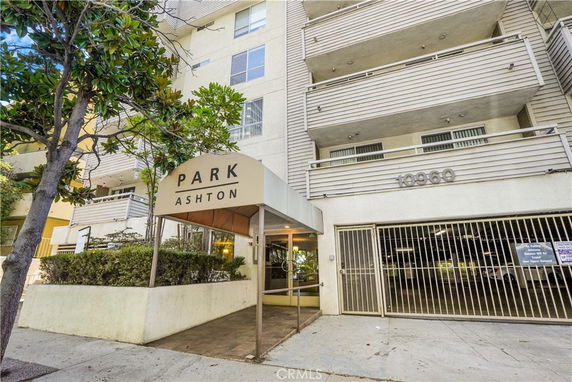 Front view of a multi-story building with balconies and an entrance canopy labeled 'Park Ashton'.