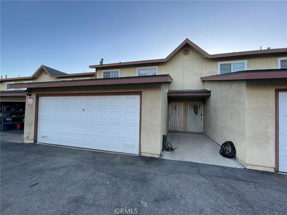 Front view of a two-story house with a double garage.