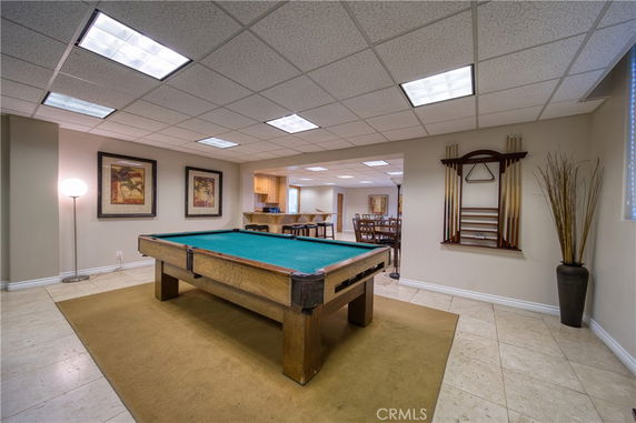 Indoor room with pool table and seating area.