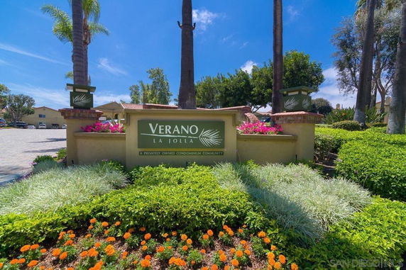 Front view of a condominium community entrance with signage.